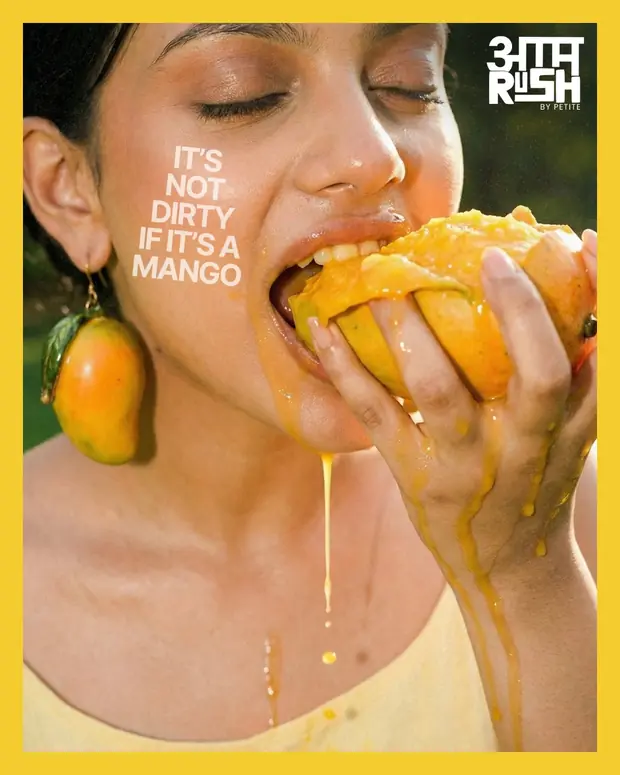 A woman eating a mango in close up, captioned it is not dirty if it is a mango.