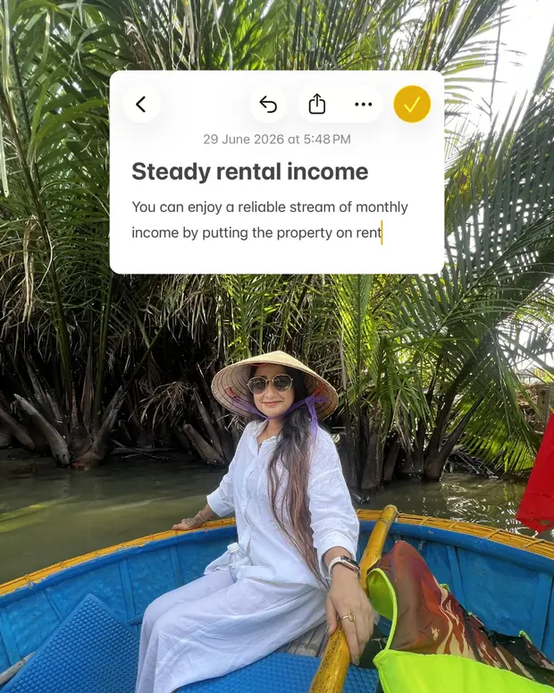 A note card headed steady rental income, laid over a photograph of a boat among palms.